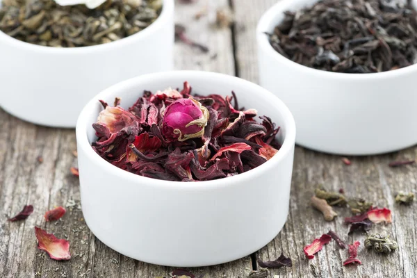 Dry herbal teas in white bowls — Stock Photo, Image