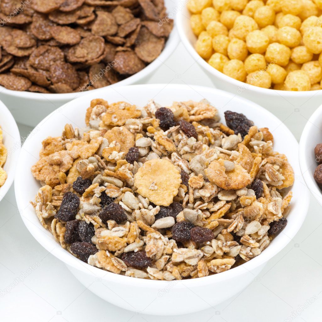 granola and various breakfast cereals in bowls