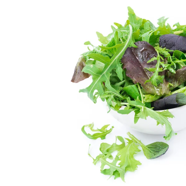 Fresh green salad in a bowl, close-up, isolated — Stock Photo, Image