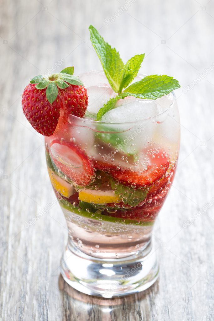 refreshing strawberry and citrus lemonade with mint, vertical