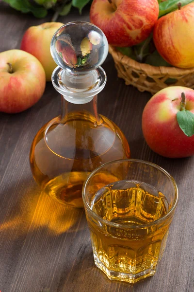 Apple cider or juice in a decanter and glass — Stock Photo, Image