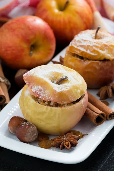 Baked stuffed apples on a plate, vertical — Stock Photo, Image