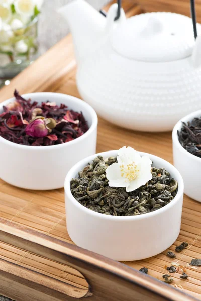Dry herbal teas and kettle of freshly brewed tea — Stock Photo, Image