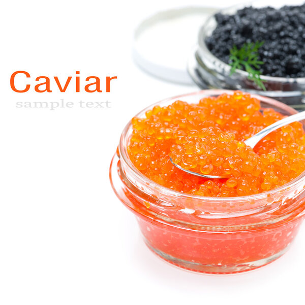 spoon of red caviar in a glass jar, isolated