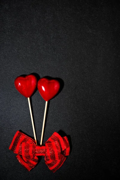 Two Red Hearts Bow Valentine Day Black Background Vertical Top — Stock Photo, Image