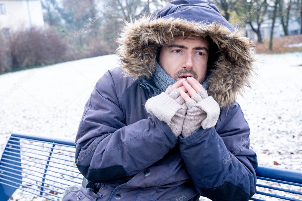 One man sensitive to cold freezing outdoor in the snow