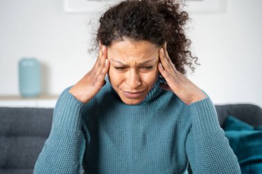 Portrait of one black woman suffering headache