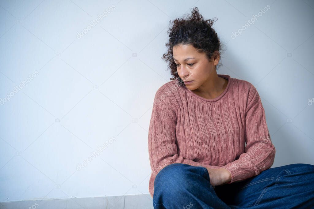 Black woman feeling negative emotions isolated on white wall