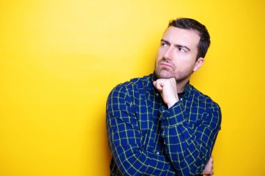 One man portrait feeling doubtful and hesitant