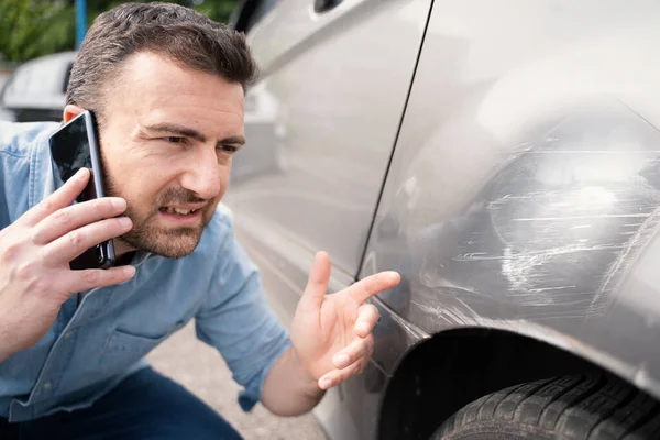 One Man Calling Insurance Reporting Car Body Scratches — Stock fotografie