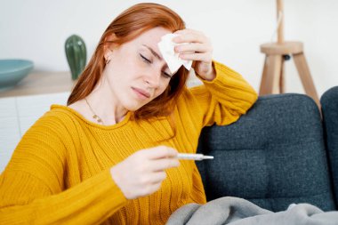 Sick woman feeling bad and suffering flu symptoms