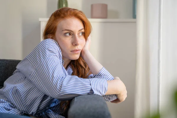 Depressed Woman Sitting Sofa Home Thinking Life Things — Zdjęcie stockowe