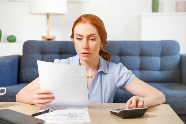 One Woman Examining Documents Using Laptop While Working Home — Φωτογραφία Αρχείου