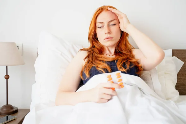 Woman Suffering Insomnia Taking Sleeping Pill — Stockfoto