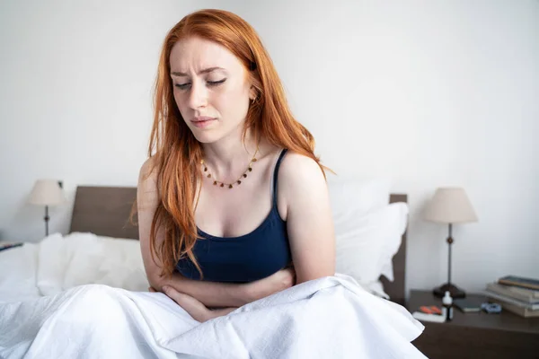Woman Suffering Menstrual Cramps Home —  Fotos de Stock