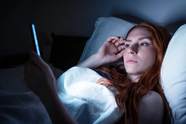 One Woman Holding Mobile Phone Bed Late Night — Foto de Stock