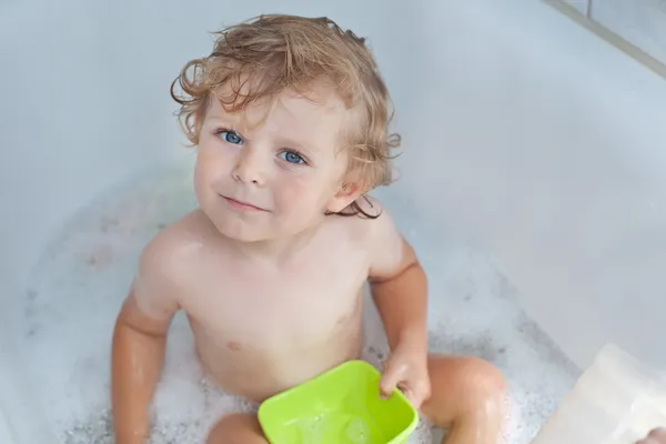 Adorable toddler taking bath Stock Image
