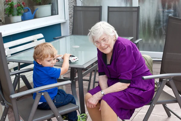 Grandmother and toddler boy in summer — Stock Photo, Image