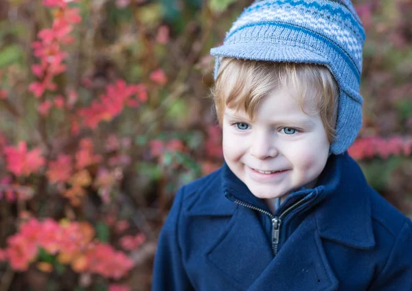 Beautiful toddler boy in blue coat on winter day — Stock Photo, Image