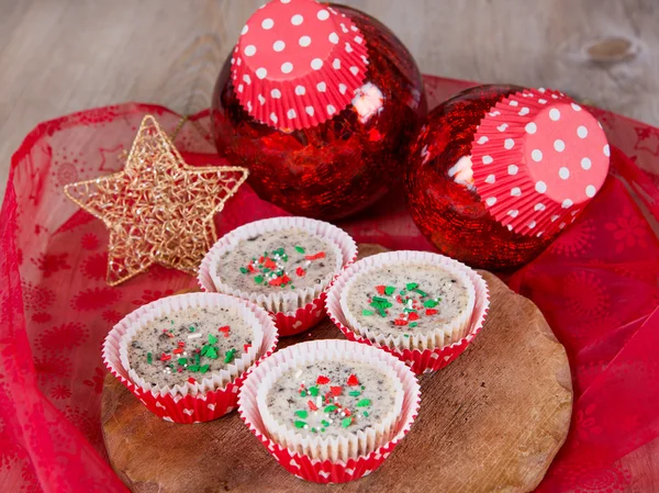 Christmas cookies and cream cheesecakes in muffin forms Stock Picture