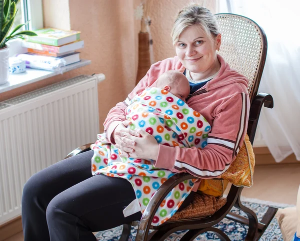 Newborn baby boy and young mother — Stock Photo, Image