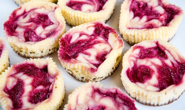 Mini strawberry cheesecakes in muffin forms — Stock Photo, Image