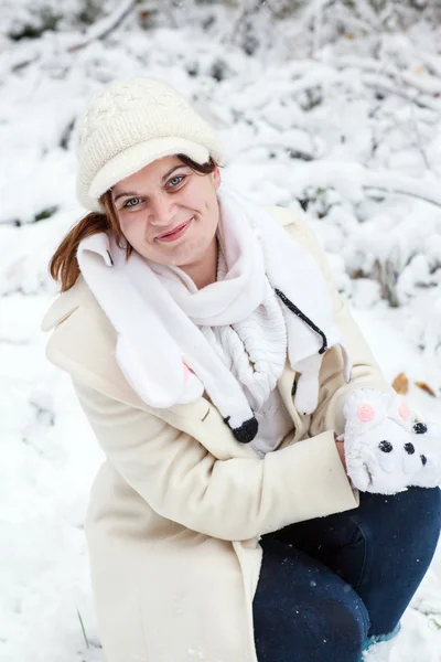 Young woman having fun with snow on winter day — Stock Photo, Image