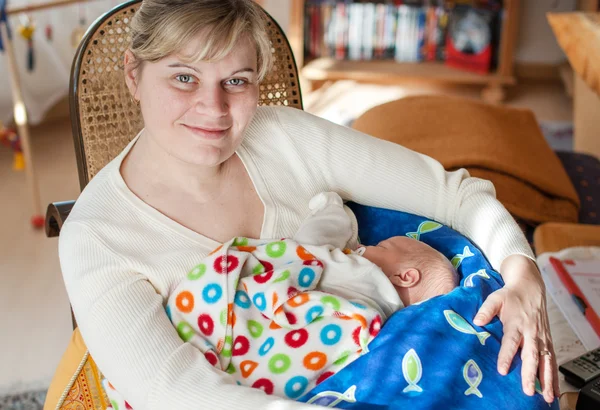 Newborn baby boy and young mother — Stock Photo, Image