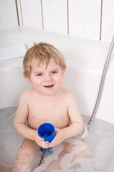 Adorable toddler boy having fun in bathtub — Stock Photo, Image