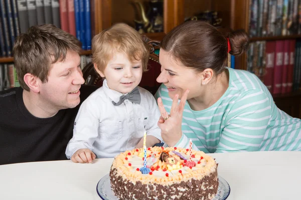 stock image Little boy celebrating his birthday at home with his parents