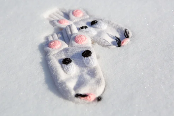 Mouse pattern gloves on winter snow — Stock Photo, Image