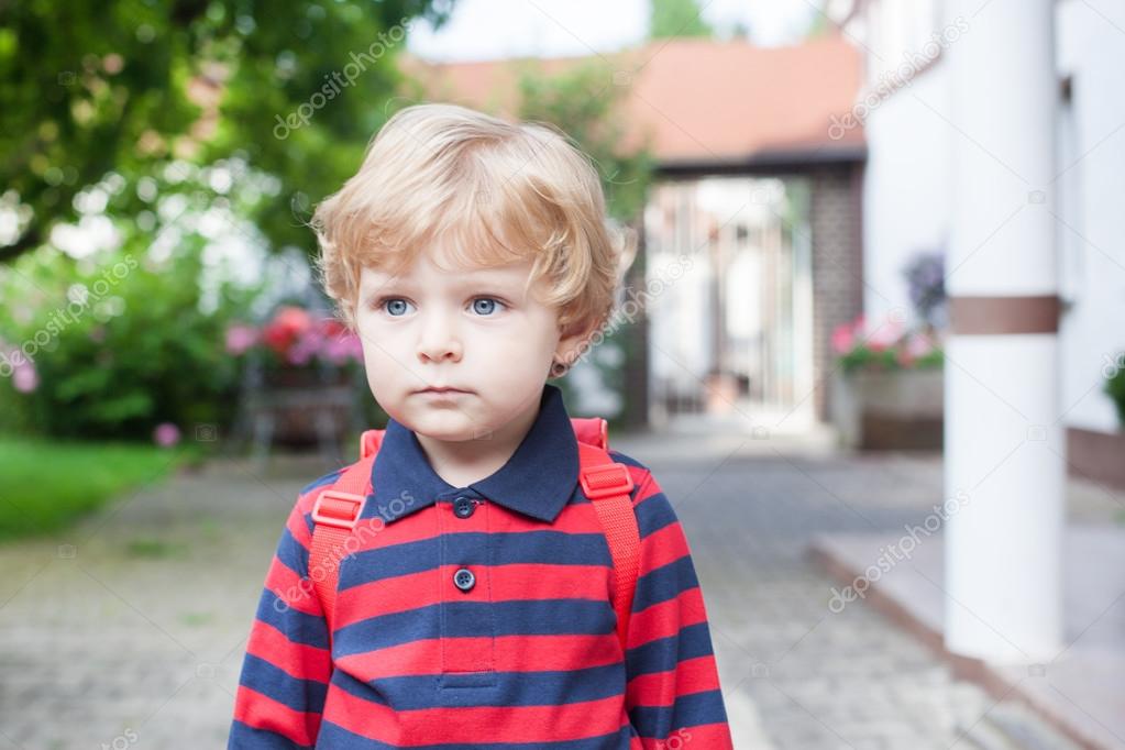 Little toddler boy on way to kindergarten