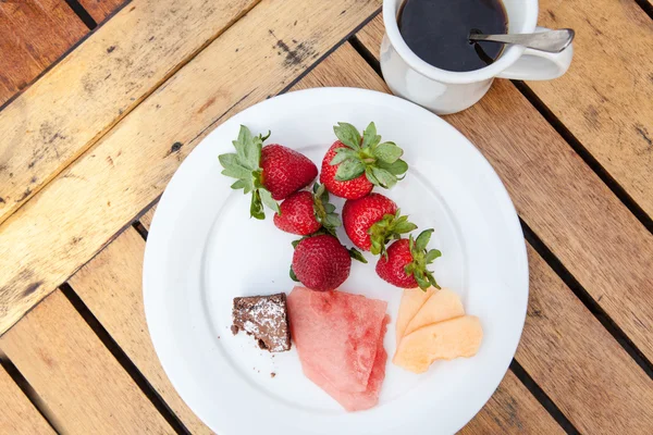 Healthy breakfast with strawberries watermelon coffee — Stock Photo, Image