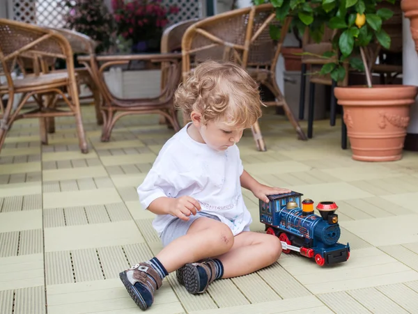 Little toddler playing on patio — Stock Photo, Image