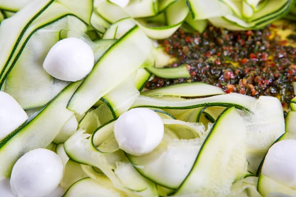 Salad with mozzarella, zucchini stripes and pepperoni — Stock Photo, Image