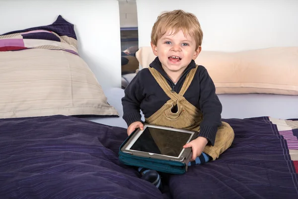 Little toddler boy playing with tablet pc — Stock Photo, Image