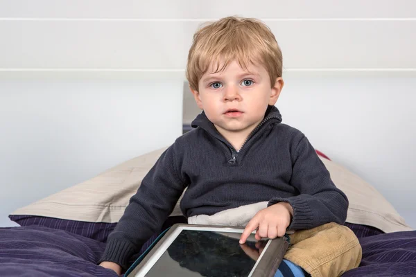 Little toddler boy playing with tablet pc — Stock Photo, Image