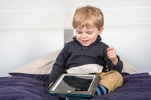 Little toddler boy playing with tablet pc — Stock Photo, Image