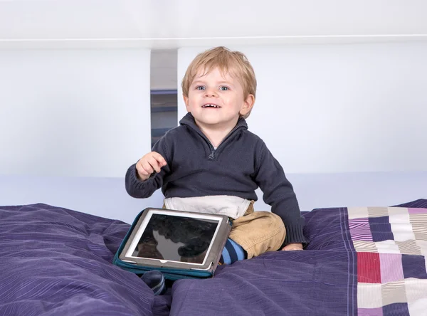 Little toddler boy playing with tablet pc — Stock Photo, Image