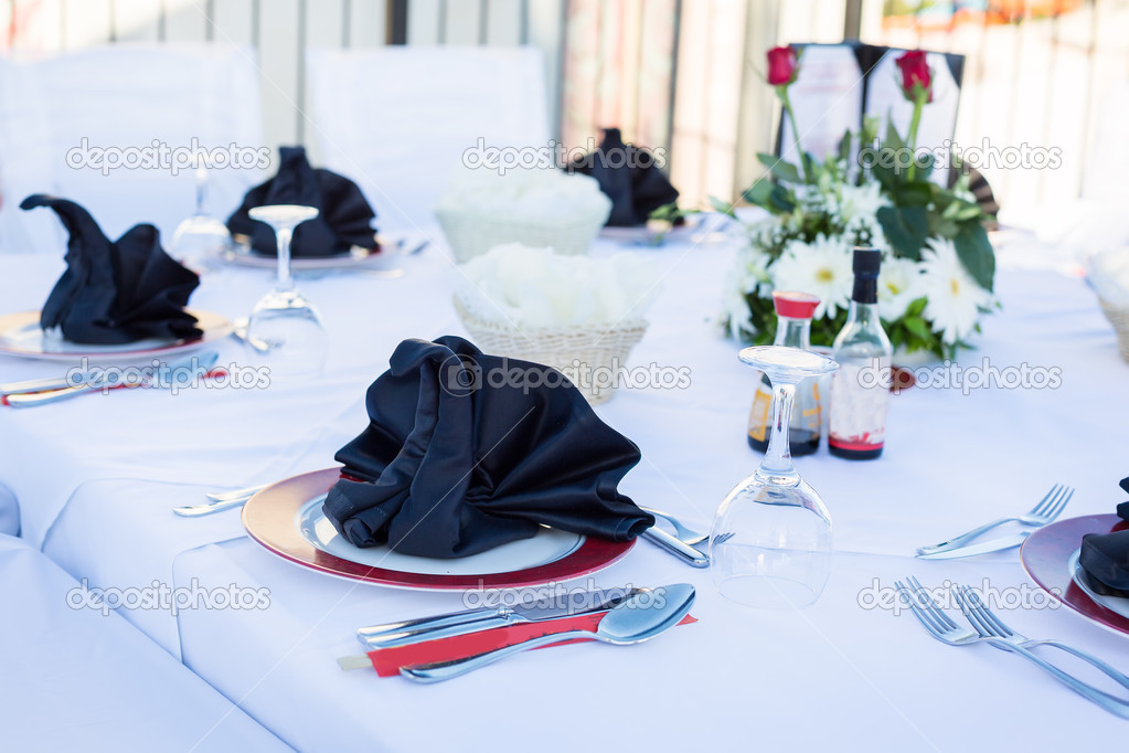 Table setting for luxurious dinner in black and white