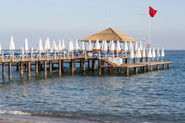 Beach with pier at the Mediterranean Resort in Turkey — Stock Photo, Image