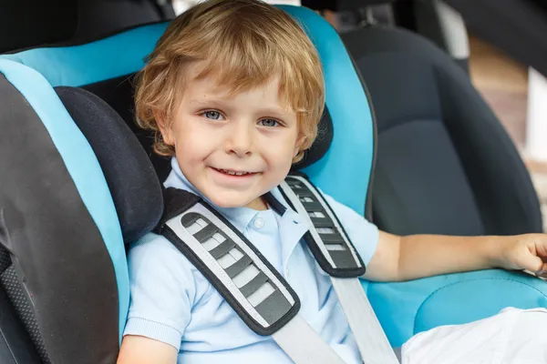 Little boy sitting in safety car sea — Stock Photo, Image