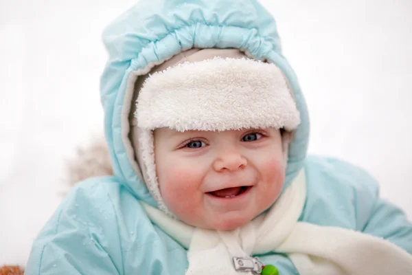 Little baby boy in sledge on winter snow day — Stock Photo, Image