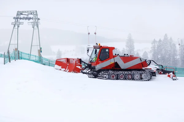 Snowplow working on a ski slope — Stock Photo, Image