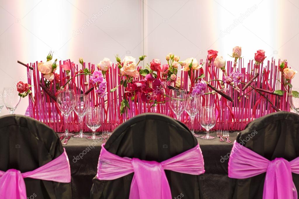 Elegant table set in pink for wedding or event party.
