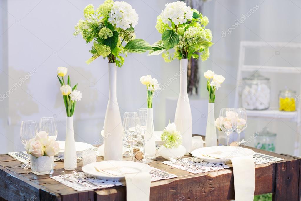 Elegant table set in soft creme for wedding or event party.
