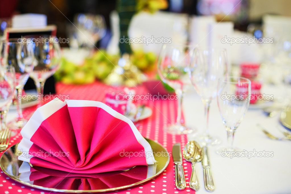 Elegant table set for wedding or event party in pink with dots.