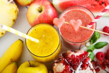 Fresh organic red and yellow smoothie with apple, watermelon, po clipart