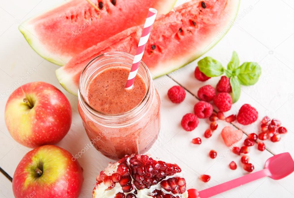 Fresh organic red smoothie with apple, watermelon, pomegranate, 
