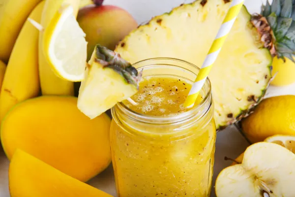 Fresh organic yellow smoothie with banana, apple, mango, pear, p — Stock Photo, Image